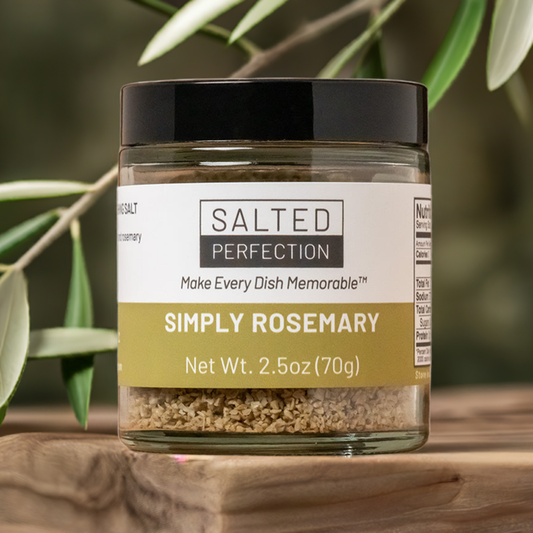 A jar of rosemary salt on a table in an olive grove